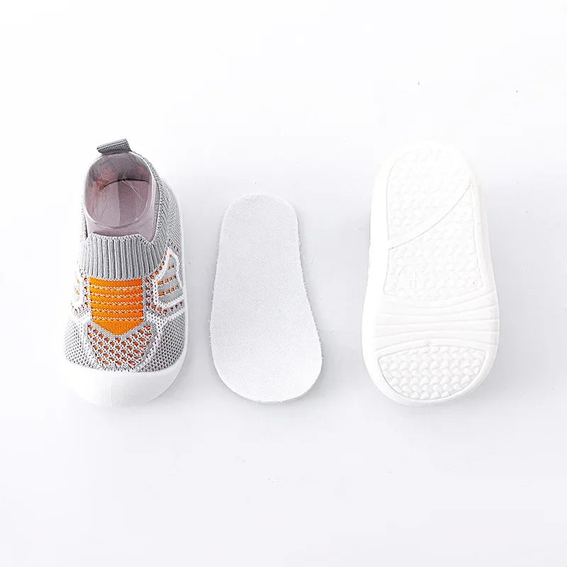 Baby shoe with textured sole on a white background
