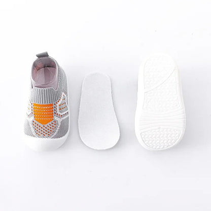 Baby shoe with textured sole on a white background